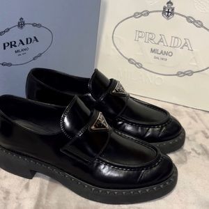Prada loafers.Color black. Size 7.5 women’s. With box and bag.